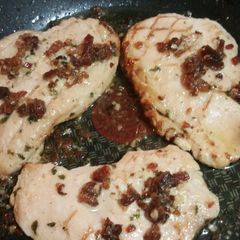A picture of Grilled Chicken with Bacon Lemon Garlic Butter Sauce.