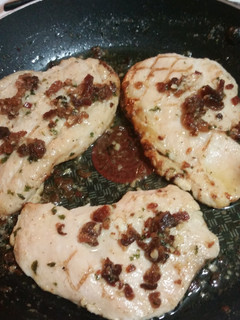A picture of Grilled Chicken with Bacon Lemon Garlic Butter Sauce.