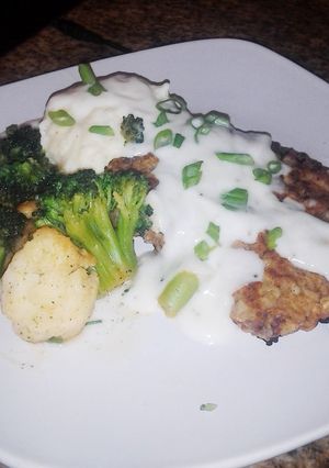 A picture of Country Fried Steak & Mashed potatoes.