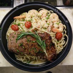 New York Stop Steak over Shrimp Scampi A picture of New York Stop Steak over Shrimp Scampi.