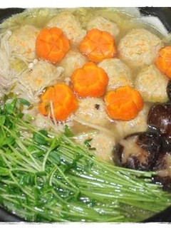 A picture of Hot Pot with Delicious Chicken Meatballs.