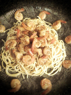 A picture of Lemon Pepper Shrimp over Pasta.
