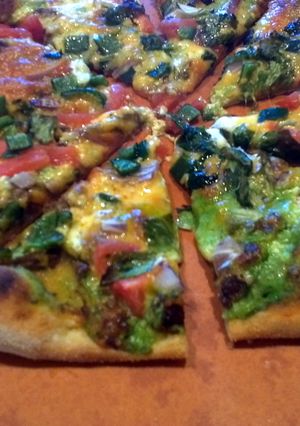 A picture of Left over taco pizza.