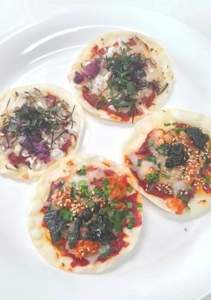 A picture of Japanese and Korean style snack pizza.