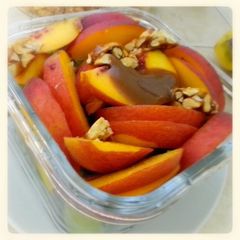 A picture of Salad with peaches & green grapes.