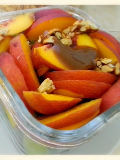 A picture of Salad with peaches & green grapes.