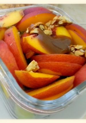 A picture of Salad with peaches & green grapes.