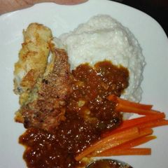 A picture of Fried fish and mealie rice.