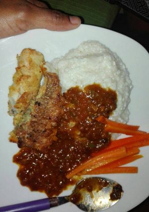 A picture of Fried fish and mealie rice.