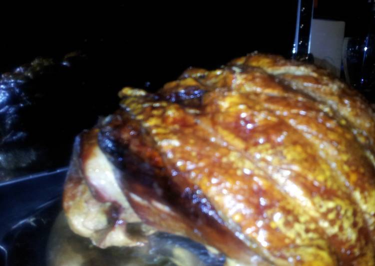 Traditional English roasted leg of pork with perfect crackling