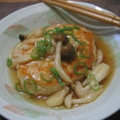 A picture of Chicken and Tofu Burgers with Mushroom Ankake Sauce.