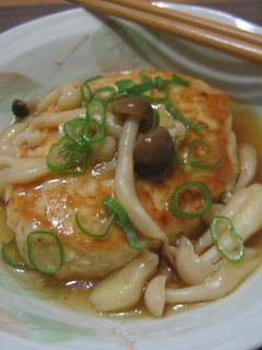 A picture of Chicken and Tofu Burgers with Mushroom Ankake Sauce.