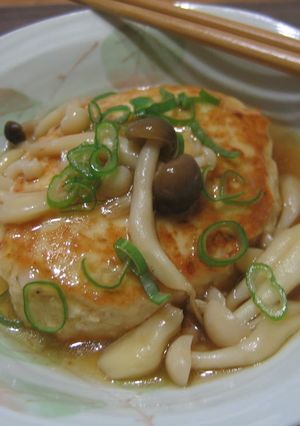 A picture of Chicken and Tofu Burgers with Mushroom Ankake Sauce.