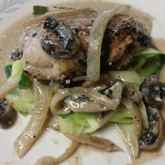 A picture of Chicken with rosemary mushroom cream sauce.
