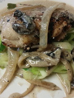 A picture of Chicken with rosemary mushroom cream sauce.