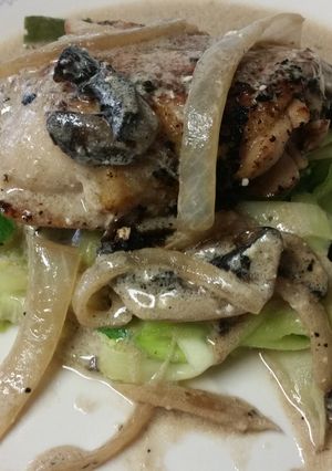 A picture of Chicken with rosemary mushroom cream sauce.