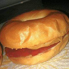 A picture of Sweet Savory Toasted peanut butter and jelly on a mini bagle.