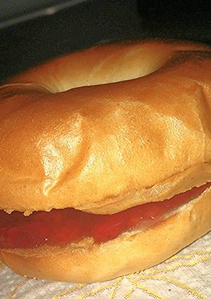 A picture of Sweet Savory Toasted peanut butter and jelly on a mini bagle.