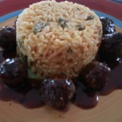 A picture of Meatballs with sweet and sour sauce.