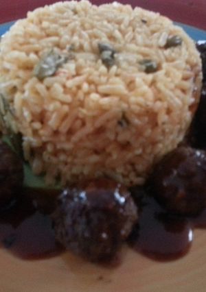 A picture of Meatballs with sweet and sour sauce.