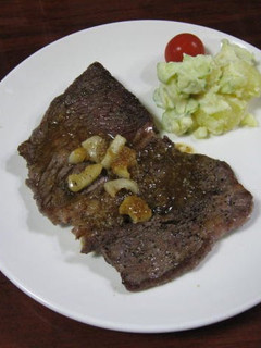 A picture of Beef Steak and Sauce.