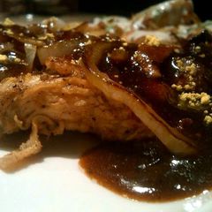 A picture of Marinated chicken with brown sauce..
