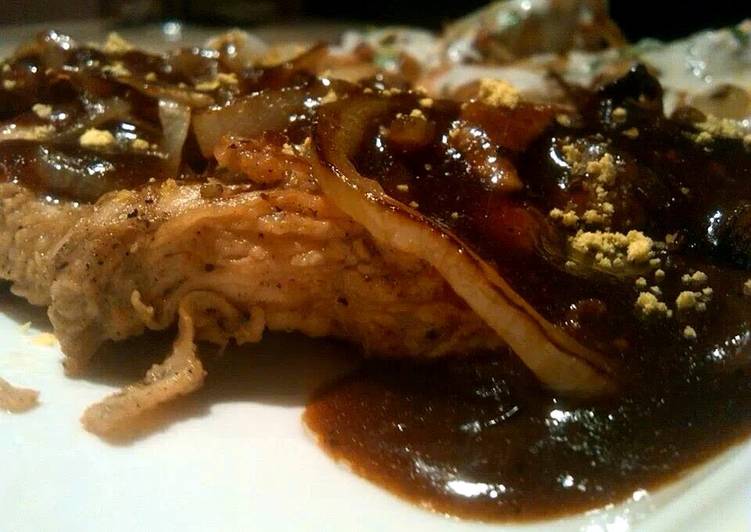 Marinated chicken with brown sauce.