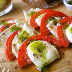 A picture of Chicken Tomato Cheese in a Basil Marinade.