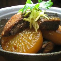 A picture of Simmered Amberjack and Daikon Radish.