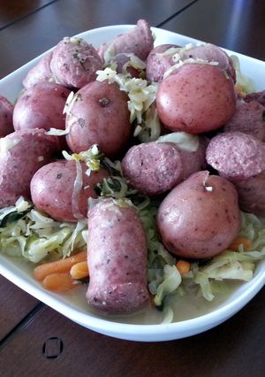A picture of Polish Wedding Sausage with Cabbage and Red Potatoes.