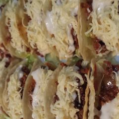 A picture of Mini tacos in sweet and spicy sauce.
