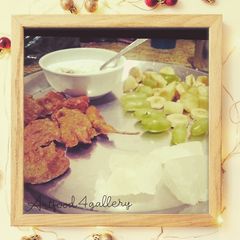 A picture of Singhada aata pakora, Agra petha,curd n fruits in frame.