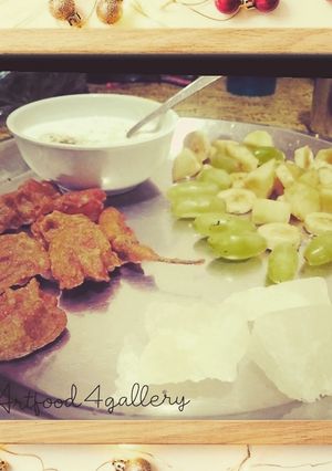 A picture of Singhada aata pakora, Agra petha,curd n fruits in frame.