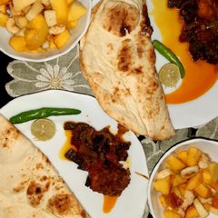 A picture of Bhindi chicken,fruit salad & homemade yogurt.