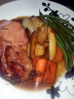 A picture of Honey and Mustard Glazed Ham with Roasted Veg and Gravy.