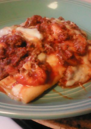 A picture of Manicotti with Meat Sauce.