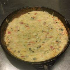 A picture of Cheesy baked eggs.