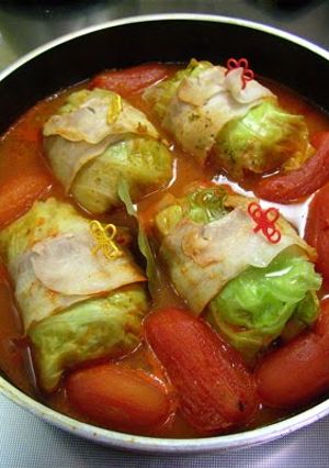 A picture of Packed with Whole Tomatoes! Hot and Comforting Cabbage Rolls.