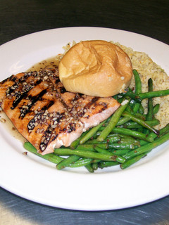 A picture of Maple Syrup, Pecan Glazed Grilled Salmon with Wild Rice and Green Beans..