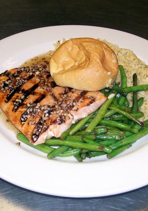 A picture of Maple Syrup, Pecan Glazed Grilled Salmon with Wild Rice and Green Beans..
