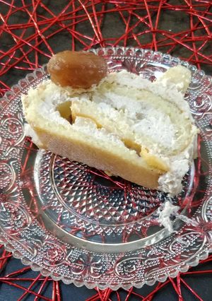 A picture of Rolled Yule Log Cake with Homemade Chestnut Cream Mousse and Pears.