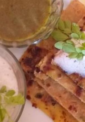 A picture of Moringa leaf and pottato stuffed shahi paratha with moringa dip.