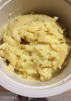 Una foto de Papas en puré con parmesano