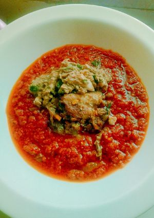 A picture of Roasted tomatoes stew garnished with fish sauce.
