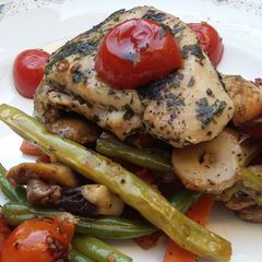 A picture of Herb Crusted Chicken over Vegetable Stir Fry.