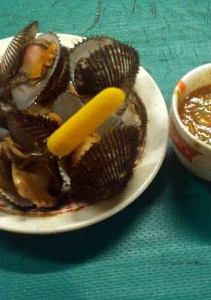 A picture of Boiled Shellfish with Pinapple and Peanut Sauce.