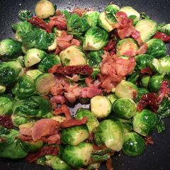 A picture of Brussel Sprouts with bacon.