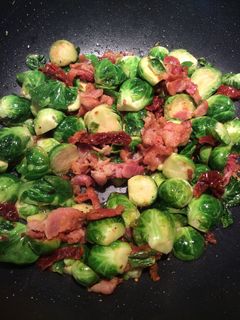A picture of Brussel Sprouts with bacon.