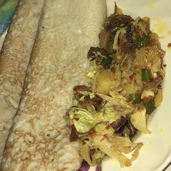 A picture of Pancakes and shredded beef sauce.