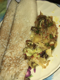 A picture of Pancakes and shredded beef sauce.